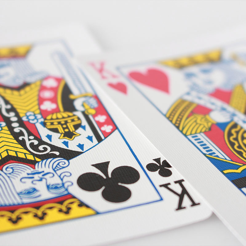A photo of two king playing cards on a white background
