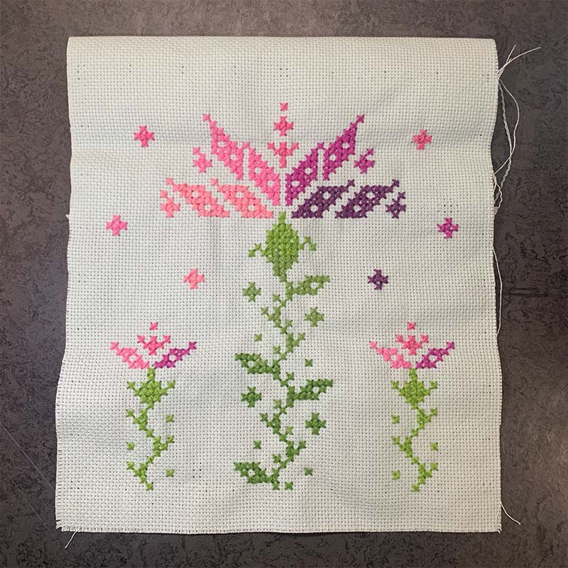 A photo of a cross-stitched thistle
