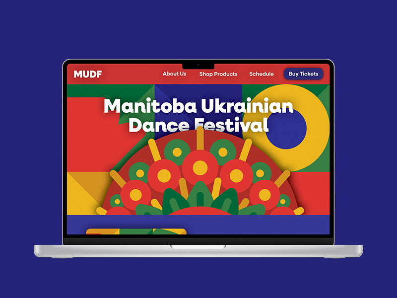 A photo of a computer showing the festival website